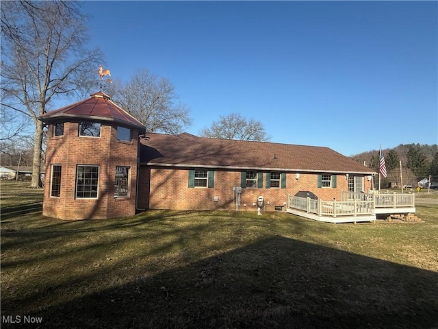31 Briar Ln, Millersburg, OH 44654 - back of property featuring a wooden deck, brick siding, and a yard