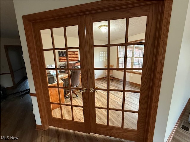 31 Briar Ln, Millersburg, OH 44654 - doorway to outside with wood finished floors, baseboards, and french doors