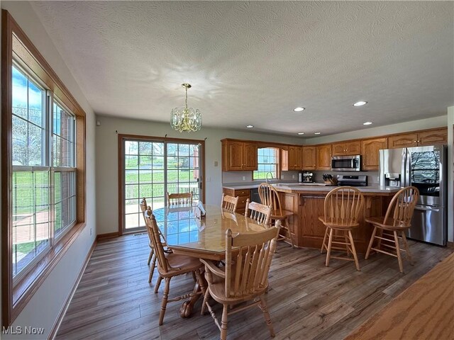 31 Briar Ln, Millersburg, OH 44654 - dining room with recessed lighting, dark wood-style floors, a textured ceiling, and a chandelier