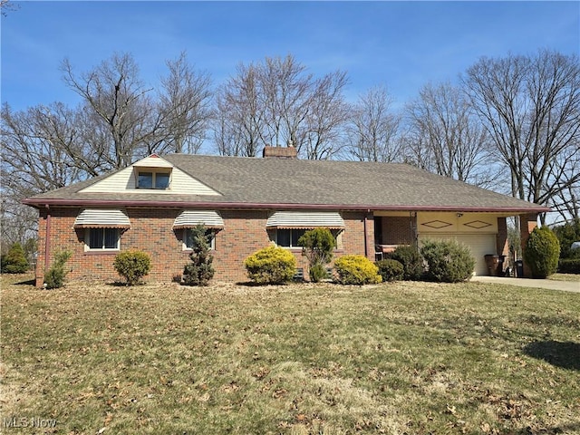view of side of home with brick siding, concrete driveway, a chimney, a yard, and a garage
