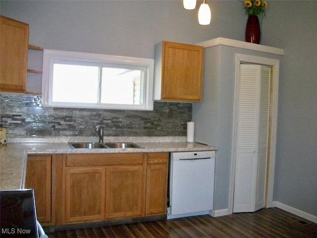 8045 State Route 555, Cutler, OH 45724 - kitchen featuring white dishwasher, dark wood-style flooring, a sink, light countertops, and tasteful backsplash