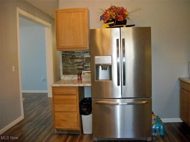 8045 State Route 555, Cutler, OH 45724 - kitchen with baseboards, dark wood finished floors, decorative backsplash, light countertops, and stainless steel fridge