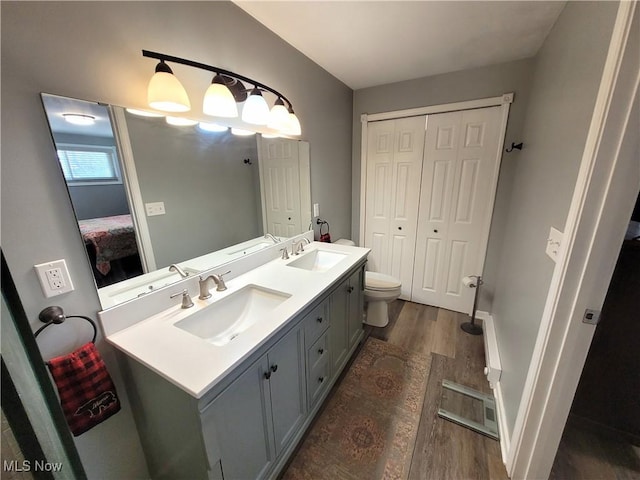 145 Maplewood Ave, Rittman, OH 44270 - full bath featuring a sink, wood finished floors, and double vanity