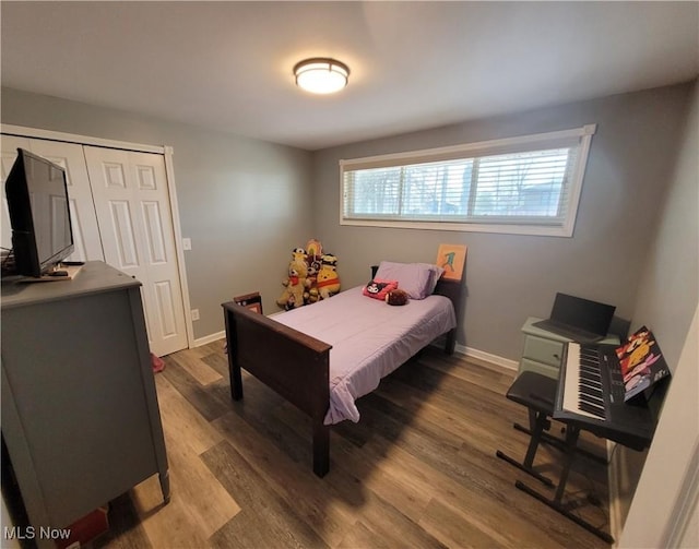 145 Maplewood Ave, Rittman, OH 44270 - bedroom featuring baseboards and wood finished floors