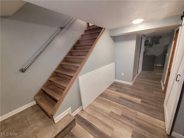 145 Maplewood Ave, Rittman, OH 44270 - staircase featuring wood finished floors and baseboards