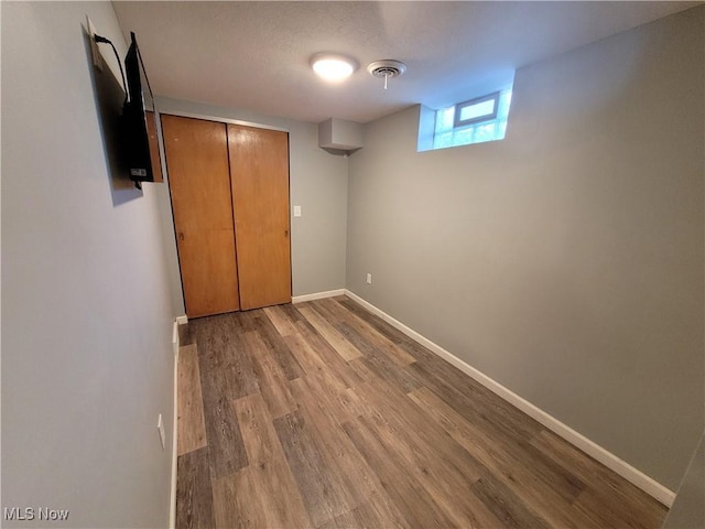 145 Maplewood Ave, Rittman, OH 44270 - unfurnished bedroom with visible vents, wood finished floors, baseboards, and a closet