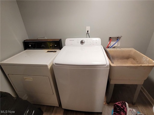 145 Maplewood Ave, Rittman, OH 44270 - laundry room featuring washer and dryer, wood finished floors, and laundry area