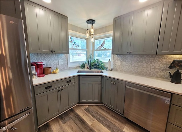 145 Maplewood Ave, Rittman, OH 44270 - kitchen with dark wood finished floors, gray cabinetry, appliances with stainless steel finishes, and a sink