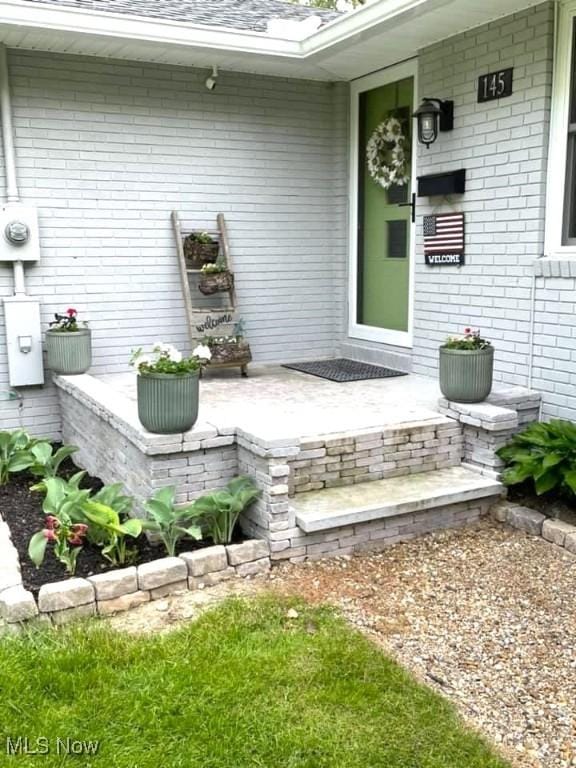 145 Maplewood Ave, Rittman, OH 44270 - view of exterior entry featuring brick siding