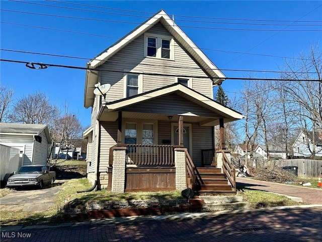 traditional style home featuring covered porch