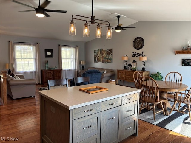 kitchen with dark wood-style floors, open floor plan, and a ceiling fan