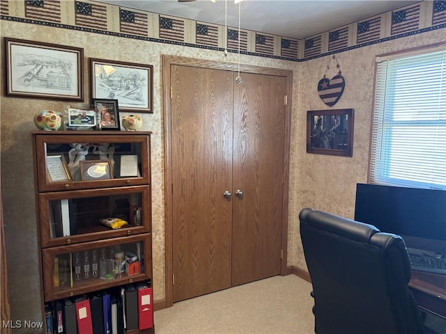 office with wallpapered walls, baseboards, and a ceiling fan