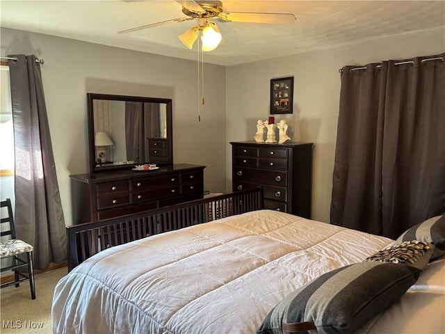 carpeted bedroom with a ceiling fan