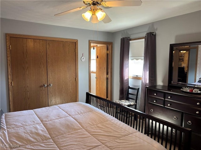 bedroom with a closet and ceiling fan