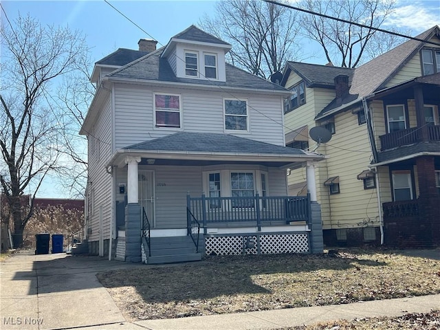 13706 Mcelhattan Ave, Cleveland, OH 44110 - traditional style home with a porch and roof with shingles