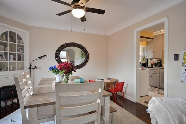 dining room with ceiling fan and wood finished floors