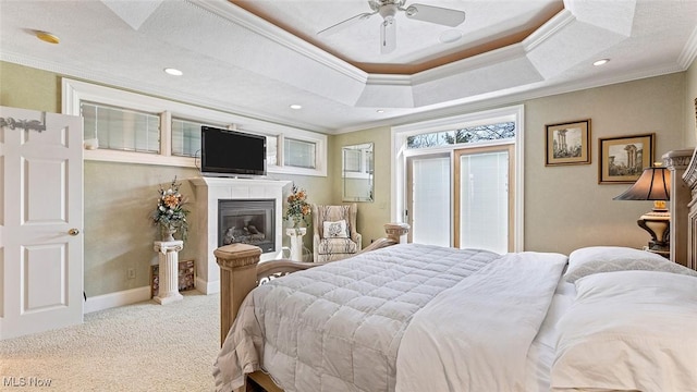 1524 Eagle Watch St NE, Canton, OH 44721 - carpeted bedroom with a glass covered fireplace, baseboards, crown molding, and a tray ceiling