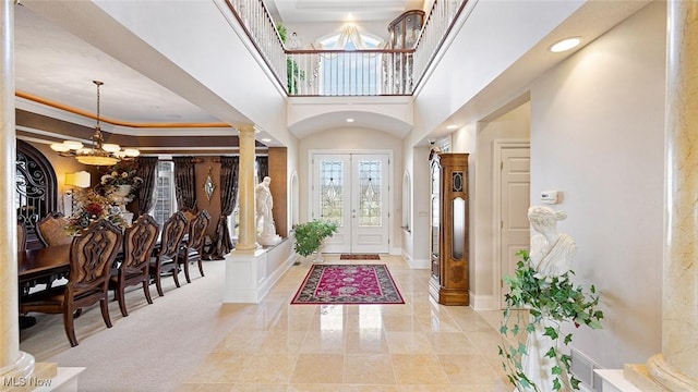 1524 Eagle Watch St NE, Canton, OH 44721 - foyer featuring baseboards, recessed lighting, a towering ceiling, a notable chandelier, and ornate columns