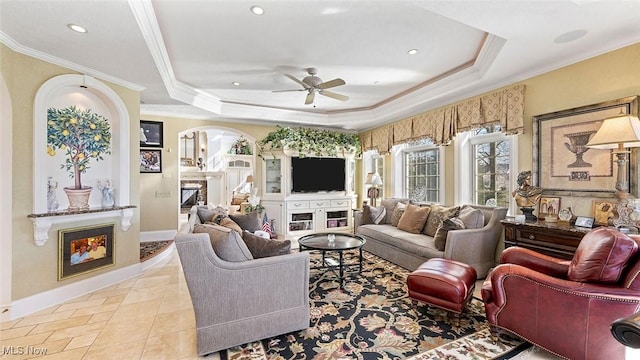 1524 Eagle Watch St NE, Canton, OH 44721 - living area with a tray ceiling, a ceiling fan, and crown molding