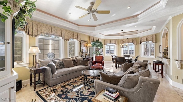 1524 Eagle Watch St NE, Canton, OH 44721 - living room featuring ceiling fan with notable chandelier, baseboards, a tray ceiling, and ornamental molding