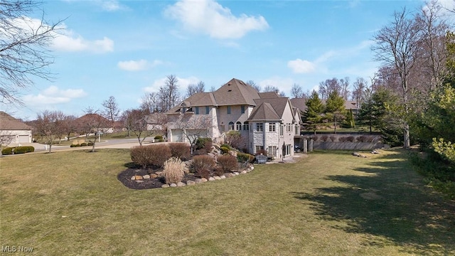 1524 Eagle Watch St NE, Canton, OH 44721 - exterior space featuring a lawn, driveway, and an attached garage