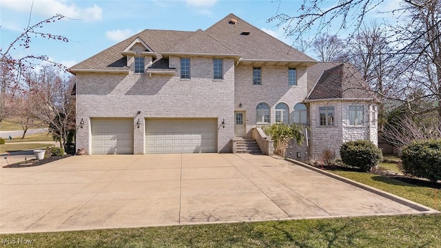1524 Eagle Watch St NE, Canton, OH 44721 - view of front of house with a garage, brick siding, and concrete driveway