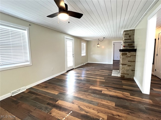 1865 Triumph Ave, Lake Milton, OH 44429 - unfurnished living room featuring a ceiling fan, visible vents, baseboards, dark wood finished floors, and wooden ceiling