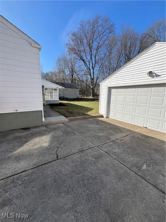 garage featuring driveway