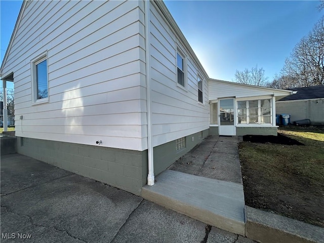 view of home's exterior featuring a sunroom