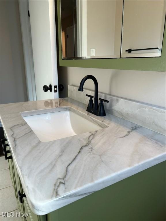bathroom featuring tile patterned floors and vanity