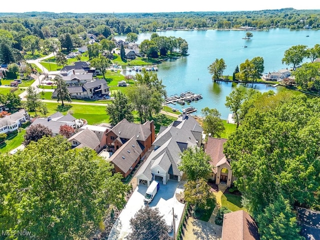 birds eye view of property featuring a residential view and a water view