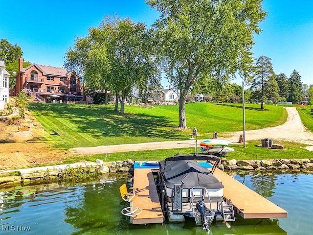 view of dock featuring a water view and a lawn