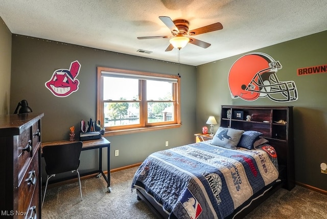 bedroom with baseboards, visible vents, carpet floors, and a textured ceiling