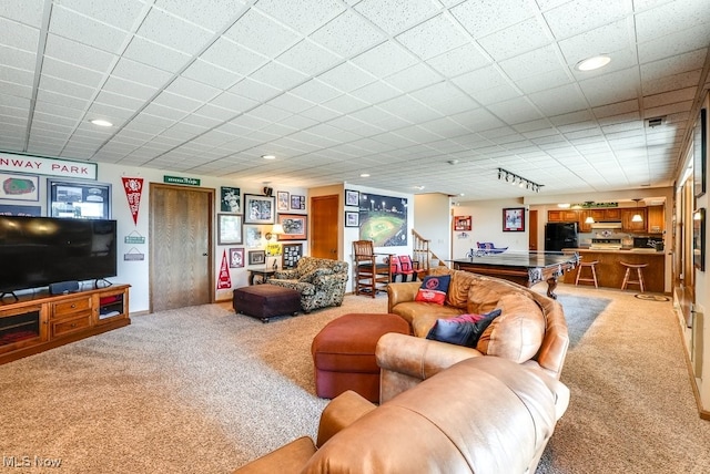 living area featuring recessed lighting and light colored carpet