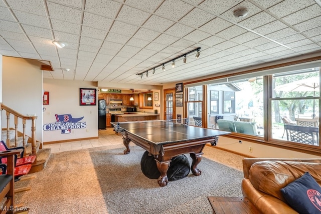game room with baseboards, a paneled ceiling, light colored carpet, rail lighting, and billiards