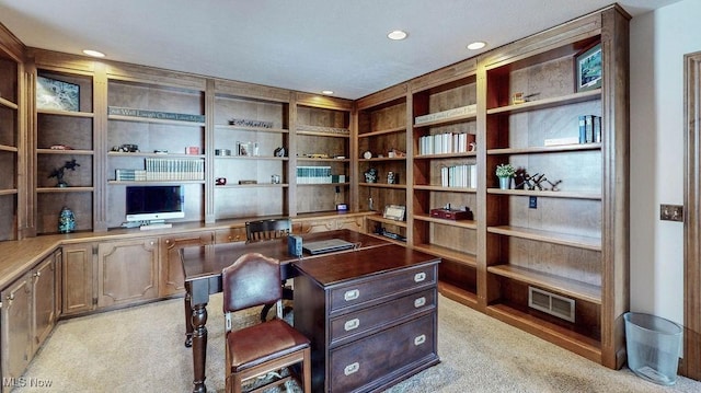 office area featuring recessed lighting, visible vents, light carpet, and built in desk