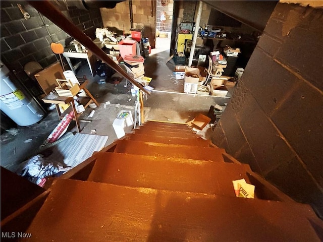 stairway with concrete block wall