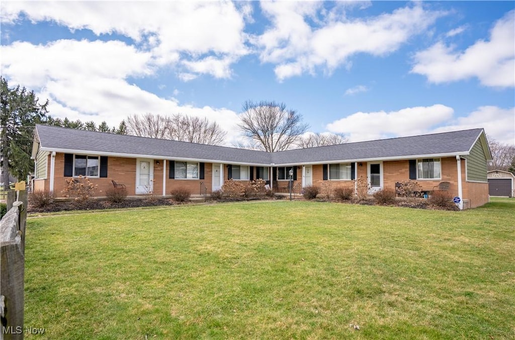 5074 S Main St, New Franklin, OH 44319 - ranch-style house featuring a front lawn and brick siding