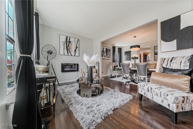 784 Hilliary Ln, Aurora, OH 44202 - living room with dark wood-type flooring and baseboards