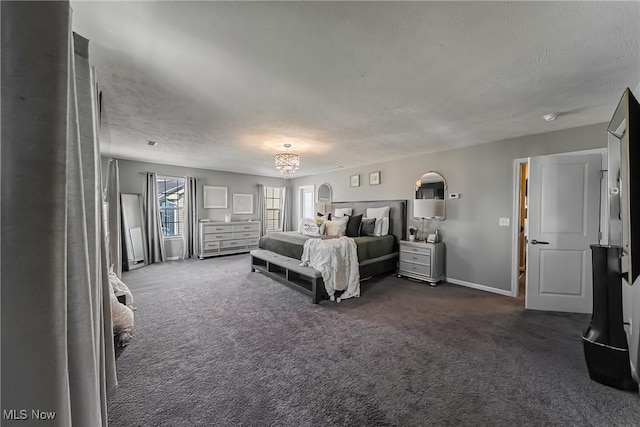 784 Hilliary Ln, Aurora, OH 44202 - bedroom with a textured ceiling, dark colored carpet, and baseboards