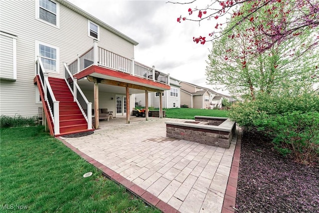 784 Hilliary Ln, Aurora, OH 44202 - rear view of house with a patio, a lawn, a deck, and french doors
