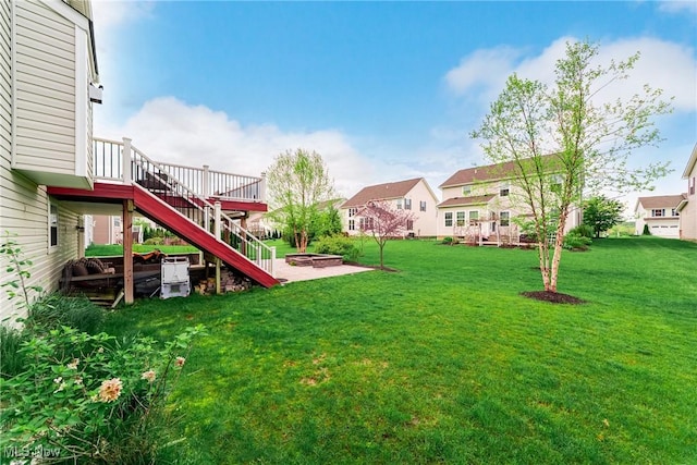 784 Hilliary Ln, Aurora, OH 44202 - view of grassy yard featuring a fire pit, stairs, a deck, and a residential view