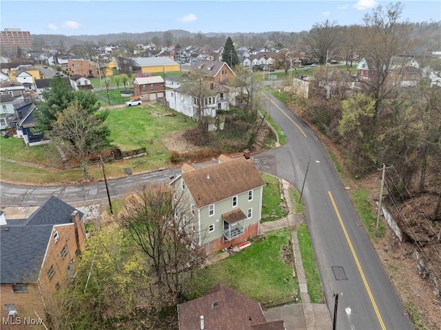 birds eye view of property with a residential view