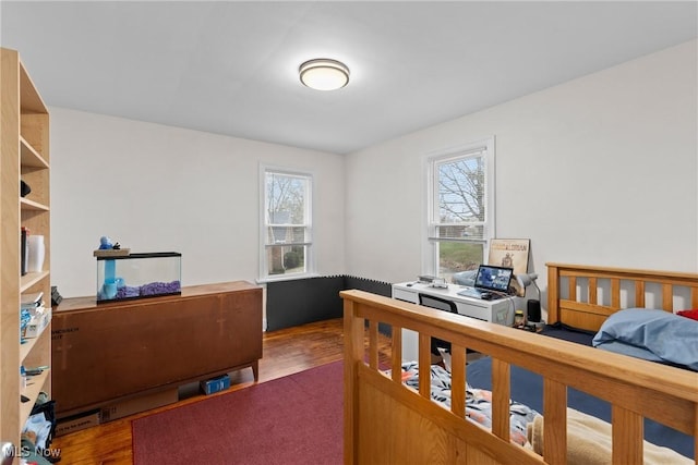 bedroom with wood finished floors
