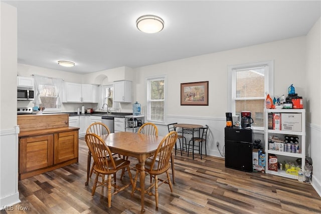 dining room with dark wood-style floors