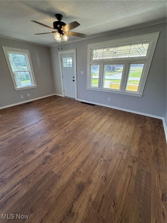 entryway featuring ceiling fan, baseboards, dark wood finished floors, and crown molding