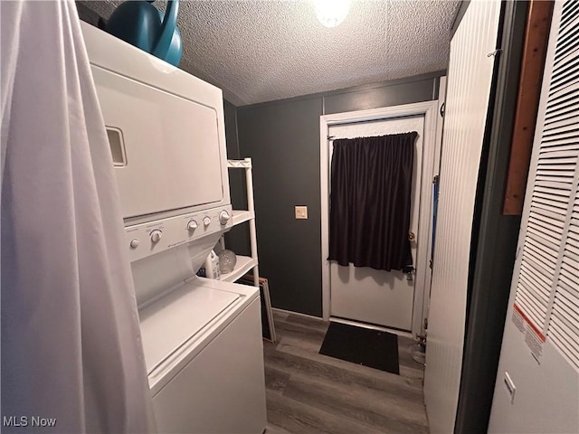 78790 Hamilton Ridge Rd, Freeport, OH 43973 - laundry room with stacked washing machine and dryer, a heating unit, wood finished floors, and a textured ceiling