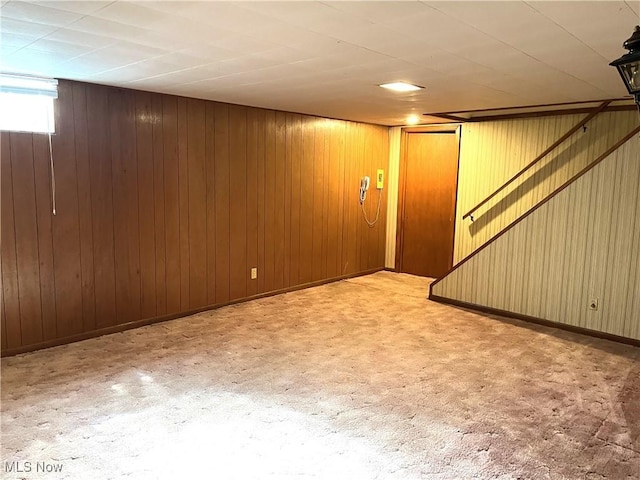 below grade area with wooden walls and baseboards