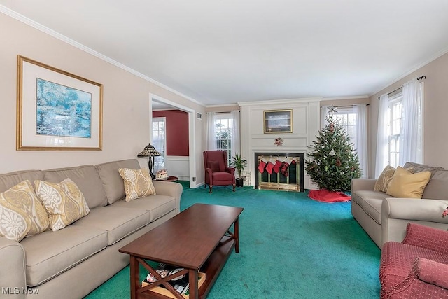living area with a fireplace, carpet flooring, and crown molding