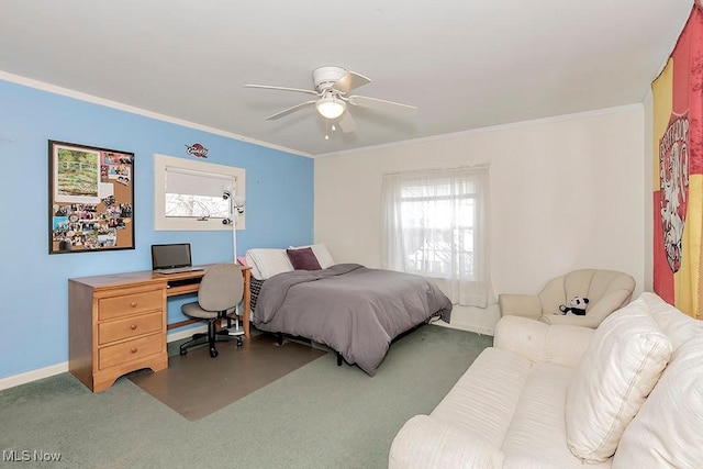 carpeted bedroom featuring ceiling fan, baseboards, and ornamental molding